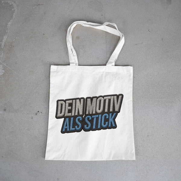 Bestickte Tragetasche mit individuellem Logo oder Motiv. Hochwertige Stofftasche mit präziser Stickerei in verschiedenen Farben – ideal für Firmenwerbung, Events, Promotion oder Merchandise.